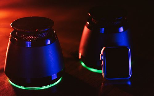 two black speakers and Apple watch